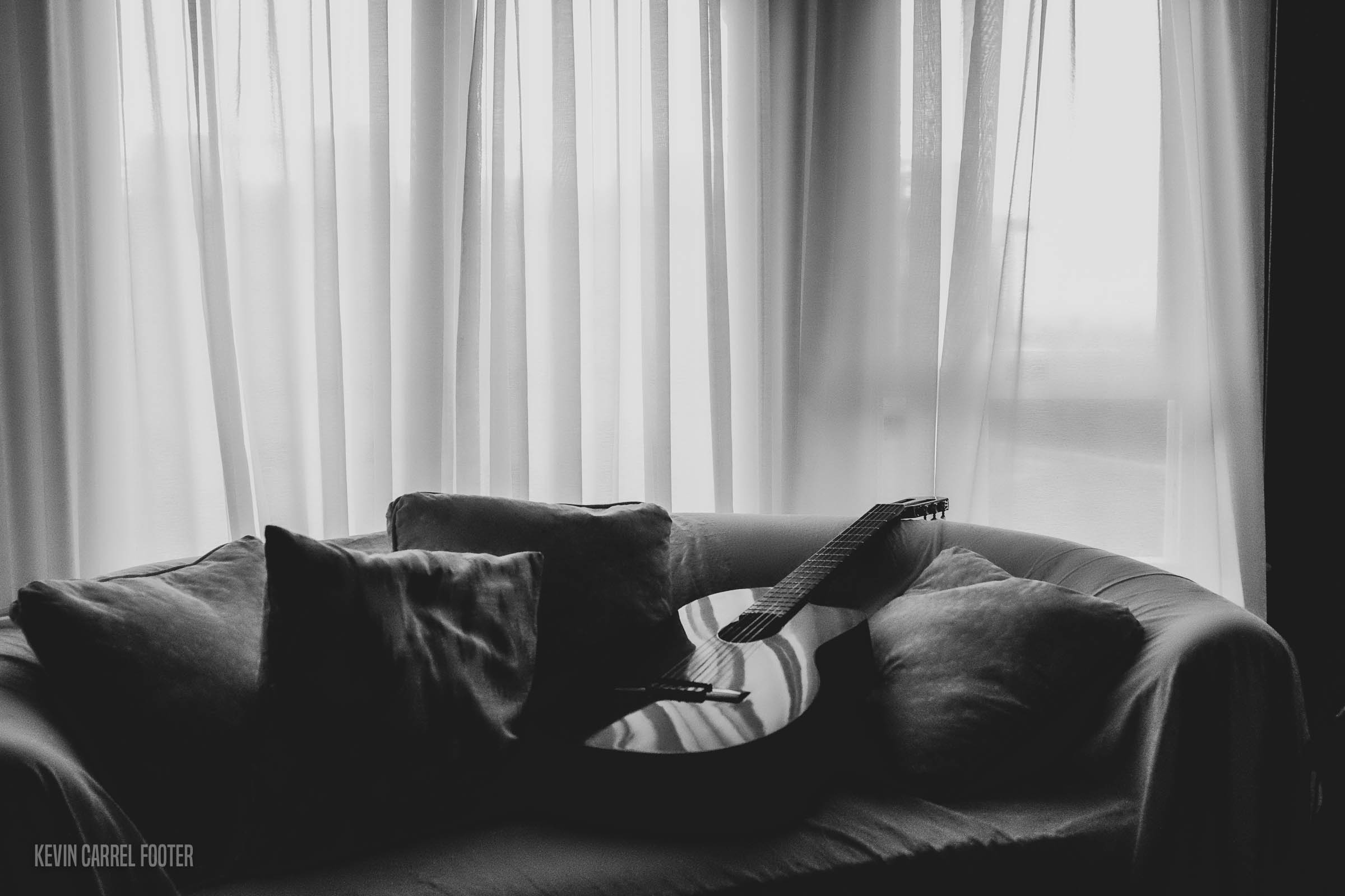 Guitar on Sofa in soft light